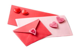 Three envelopes decorated with hearts